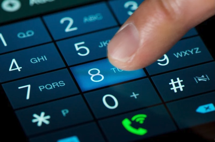 A close-up of a person dialing numbers on a smartphone keypad in Monmouth County, New Jersey — symbolizing local businesses using AmeriTel’s cloud-based and hosted phone services for modern communication.